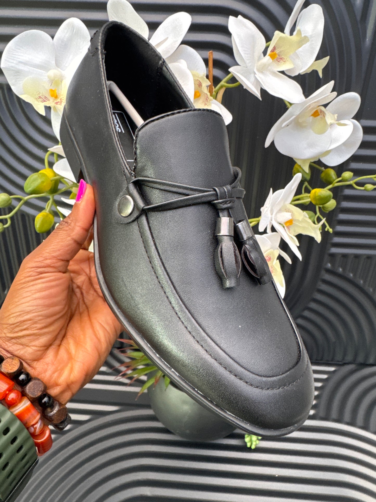 Black Slip on loafers with tassel details