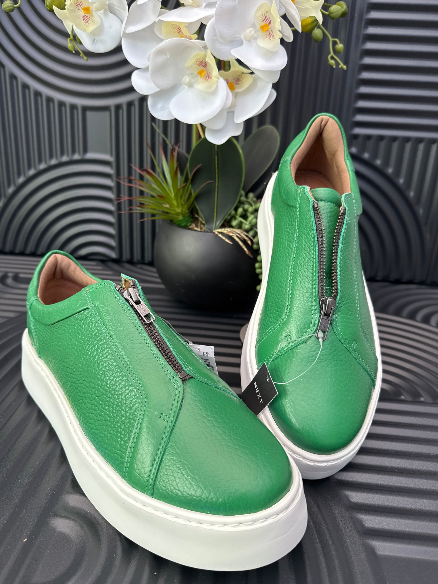 Green slip on sneakers zip detail