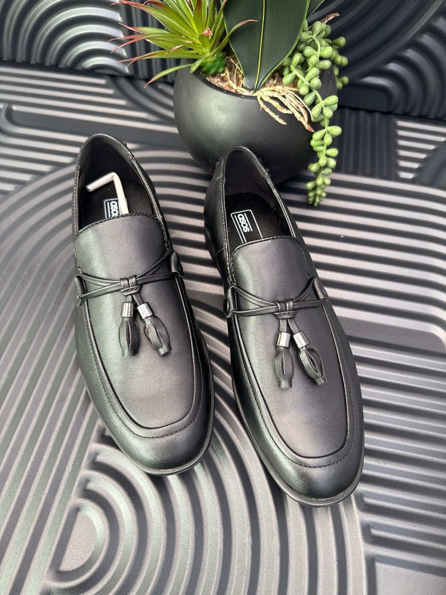 Black Slip on loafers with tassel details