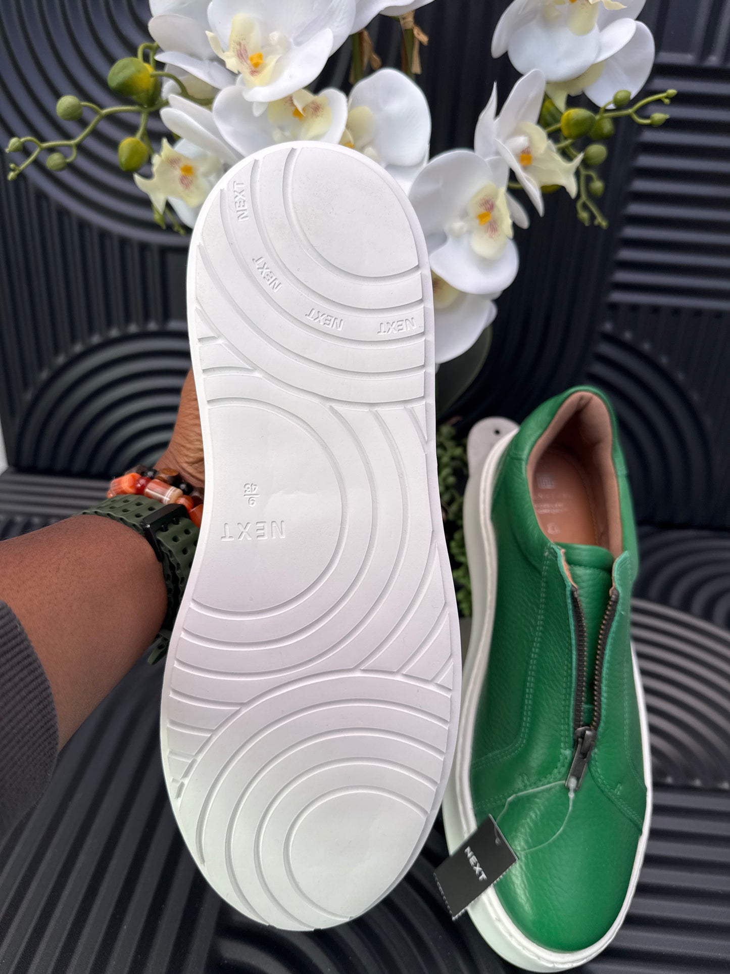 Green slip on sneakers zip detail