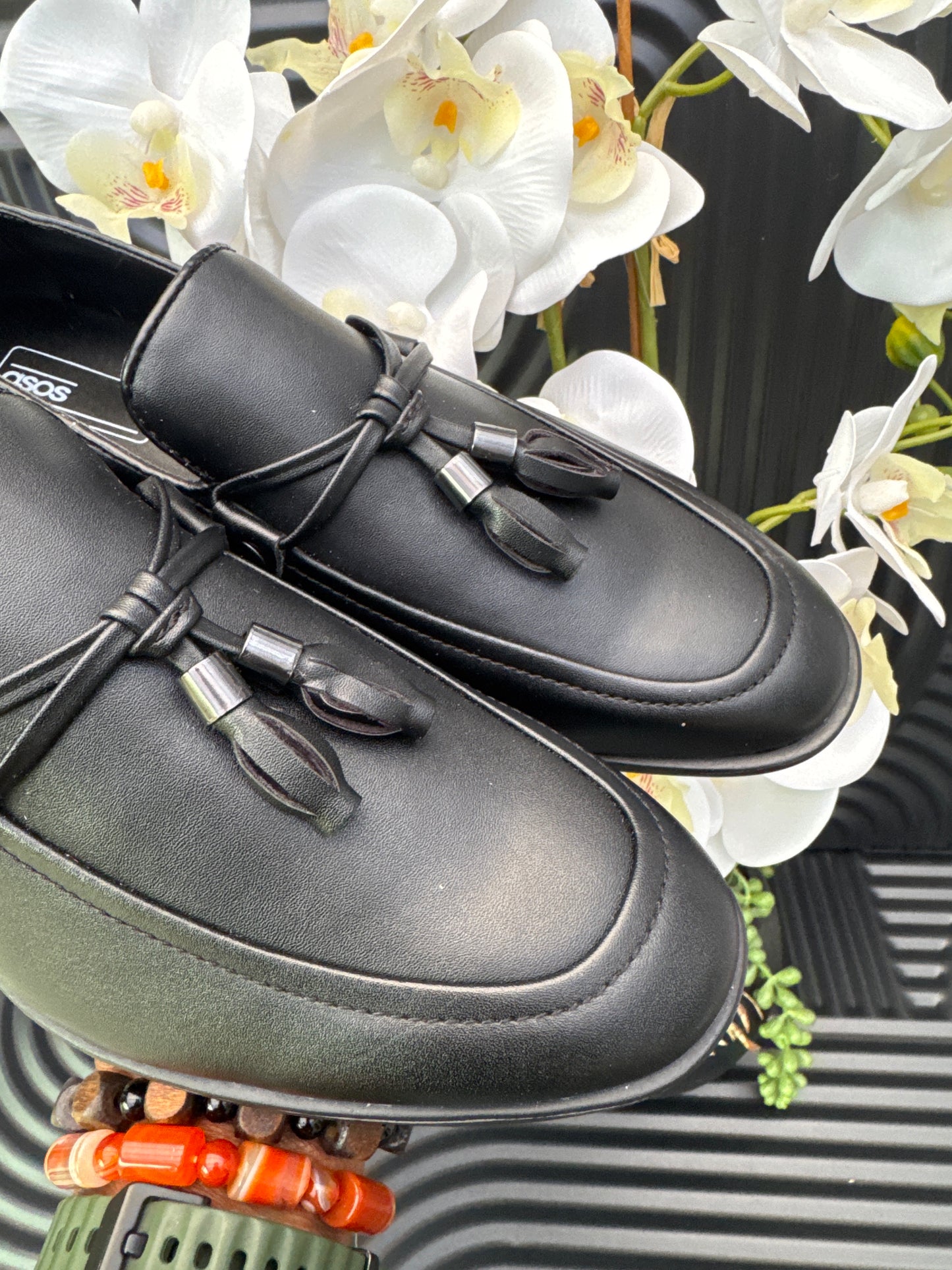 Black Slip on loafers with tassel details
