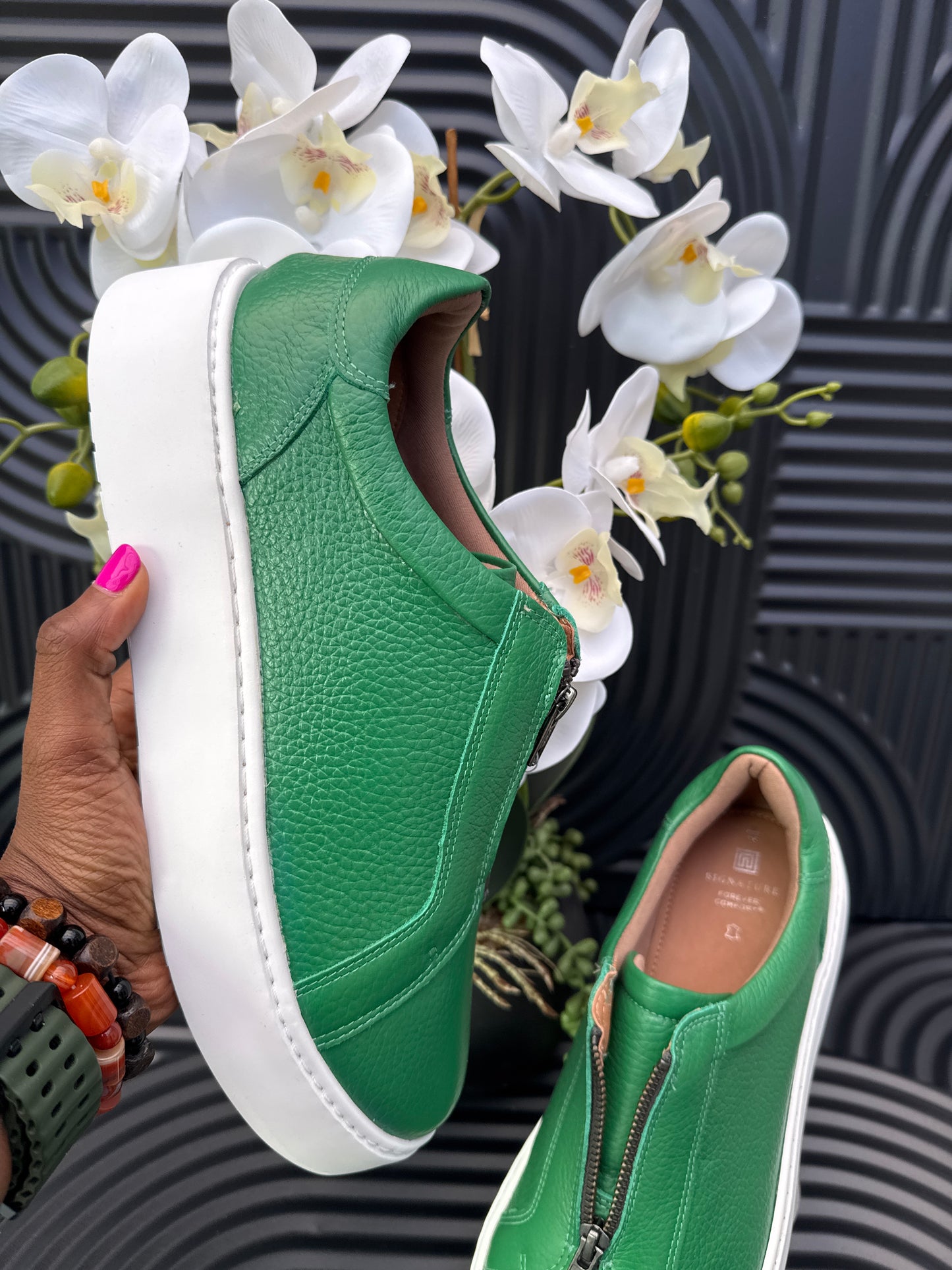 Green slip on sneakers zip detail