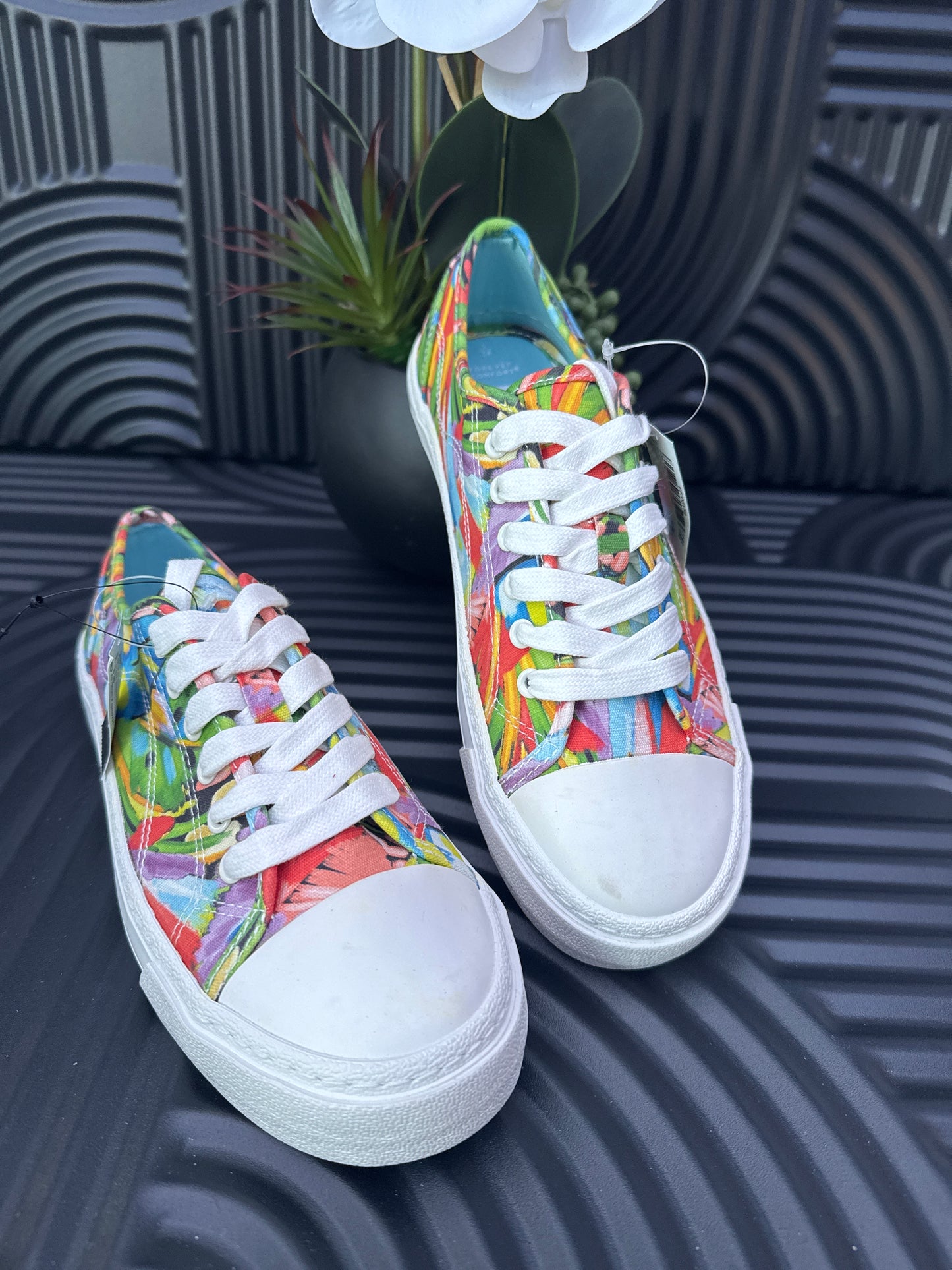 Floral detail lace up trainers