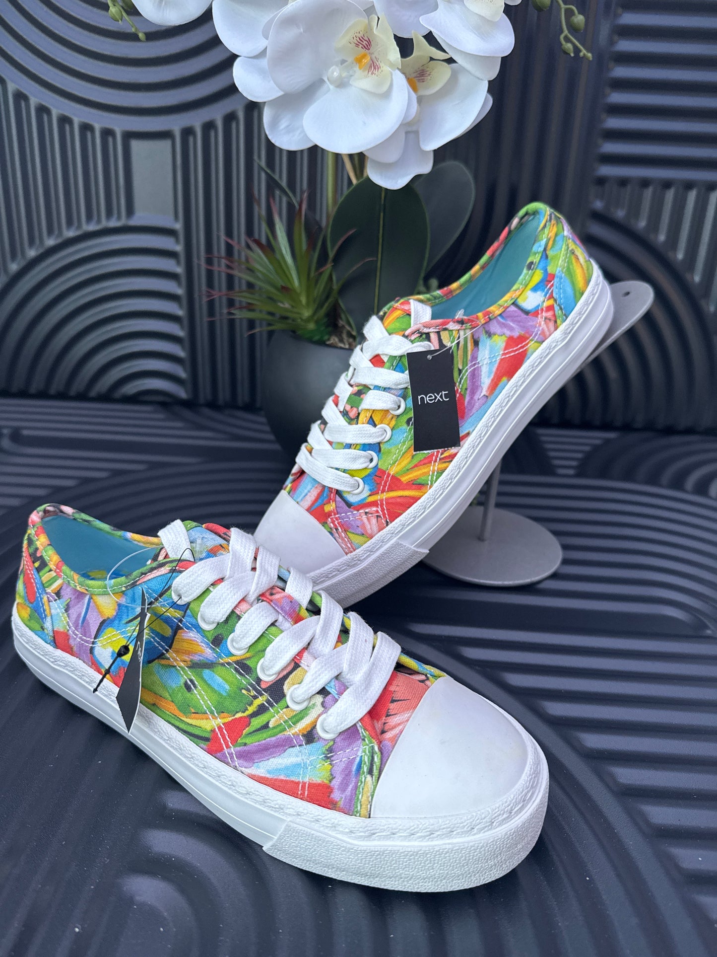 Floral detail lace up trainers