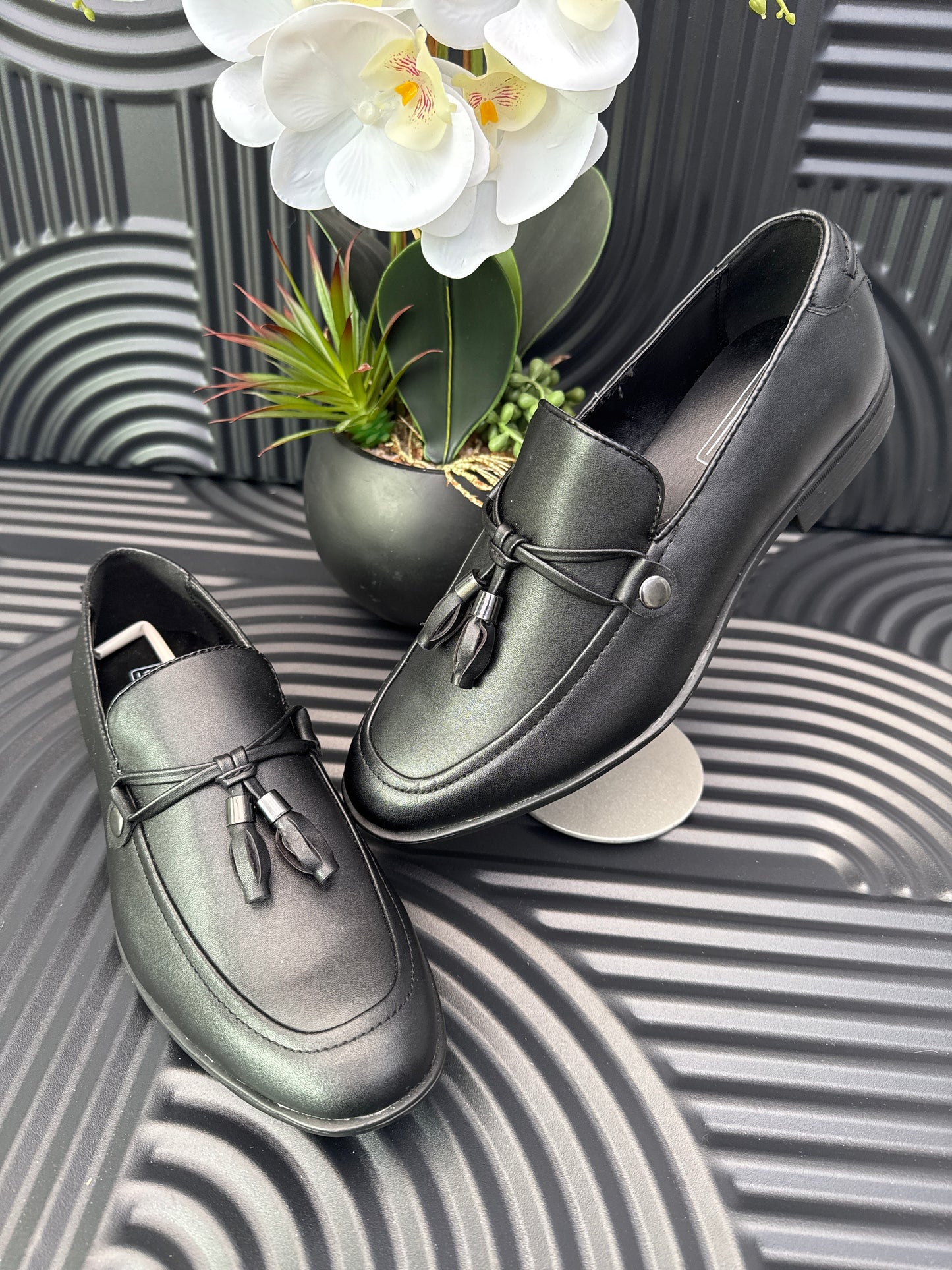 Black Slip on loafers with tassel details