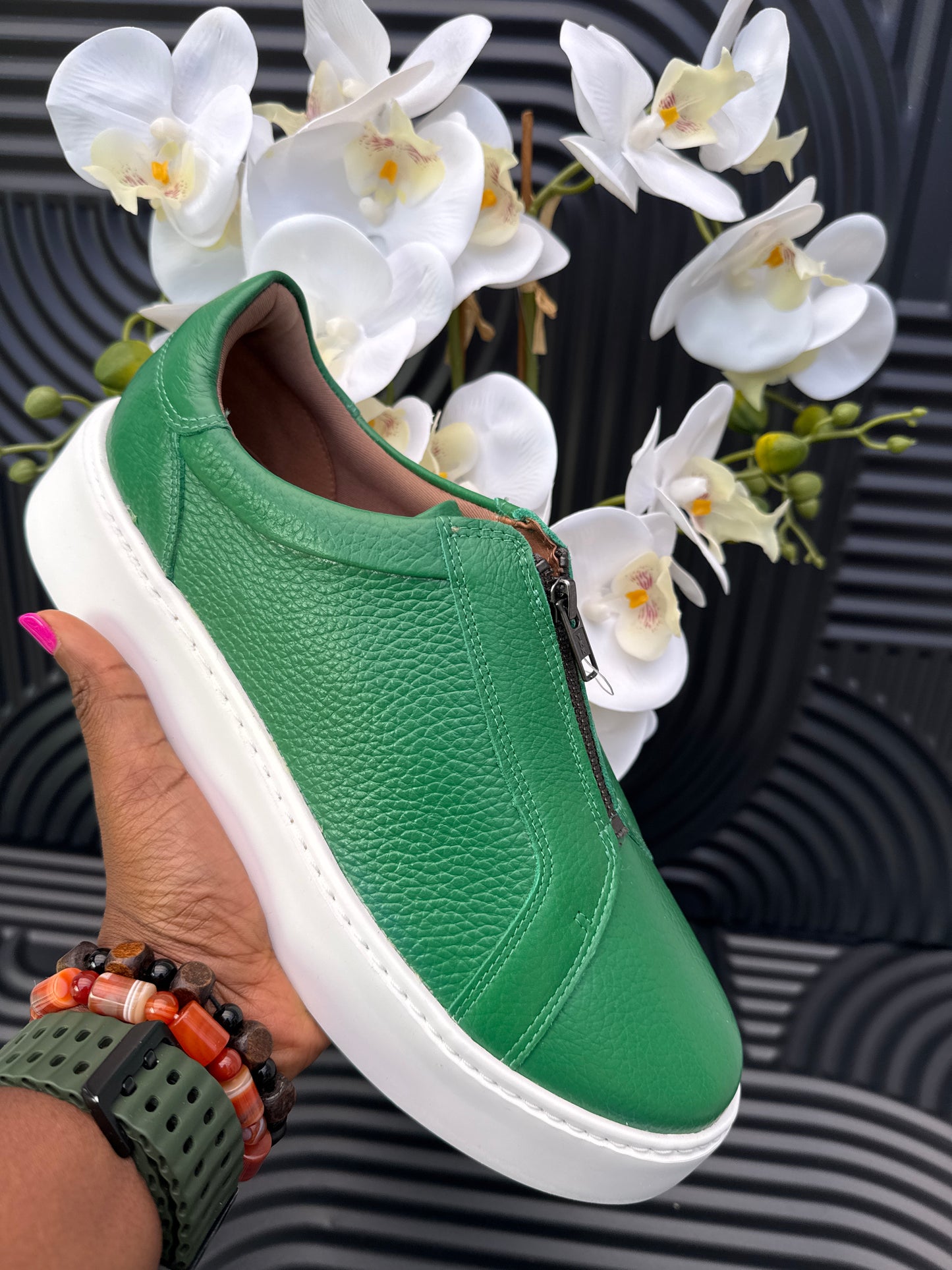 Green slip on sneakers zip detail