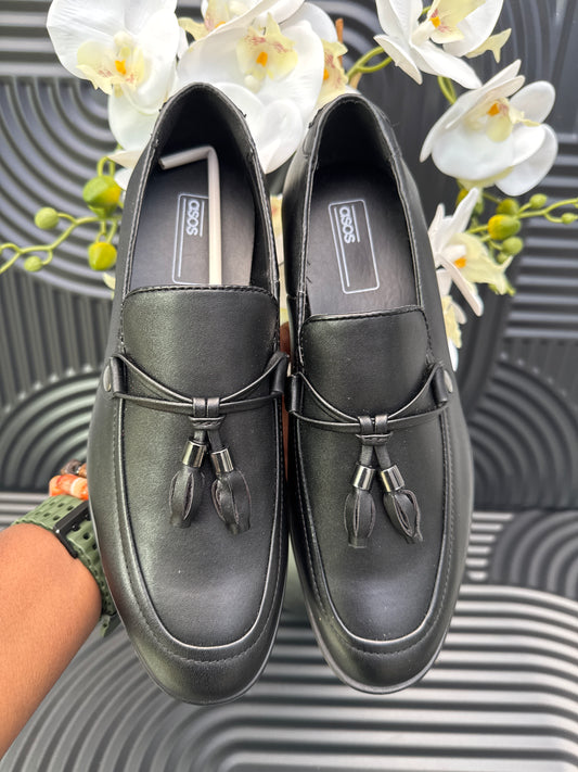 Black Slip on loafers with tassel details