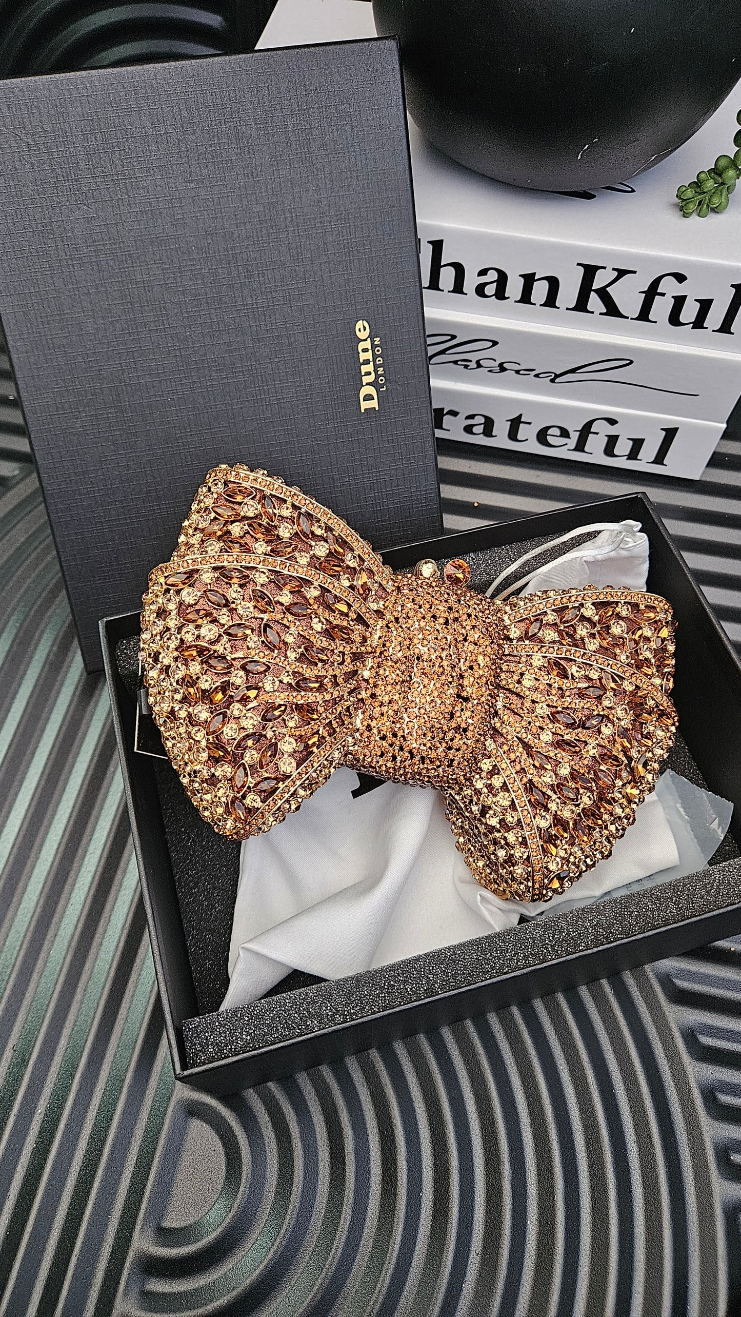 DUNE Bronze Bow Clutch Bag